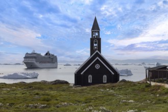 Typical architecture of Greenland Ilulissat with colored houses located near fjords and icebergs