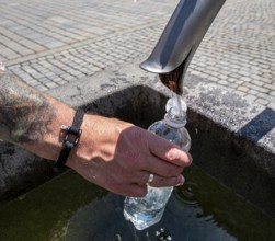 Drinking water supply at a public well, Bavaria, Germany