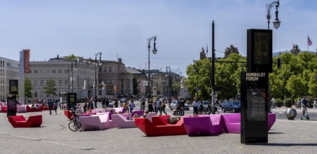 Colourful seating elements on the open space in front of the entrance to the Humboldt Forum,