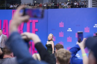 Pamela Anderson between fans at the film premiere of The Naked Gun at UCI Luxe East Side Gallery,