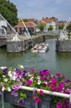 Middelburg, Zeeland, Netherlands - Town houses on the inner harbour in the old town. Tourists take