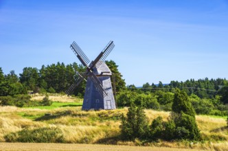 Historic windmill in an epic summer landscape near the burial ground of Stenhusbacken and the