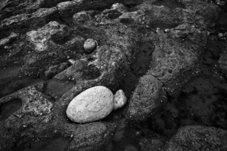 Pebbles, stones, pebbles on the beach, black and white, Yport, chalk cliffs, alabaster coast, La