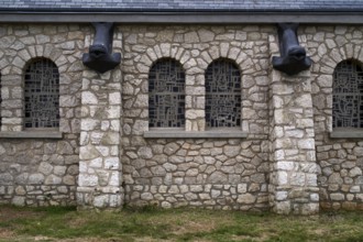 Side view, decorations, fish heads as gargoyles, church Chapelle Notre Dame de la Garde, Étretat,