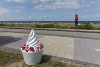 Decorative sundae with strawberries and icing on the cake, eye-catcher on the beach promenade,
