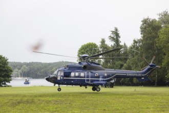 A helicopter with Emmanuel Macron (President of the French Republic) on board in front of a joint