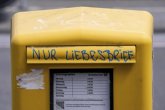 Deutsche Post letterbox, with stickers and graffiti, labelled Only love letters, Leverkusen, North