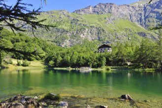 View of mountain lake Lago Grande near Moncenisio in Val Cenischia in the Graian Alps, behind it