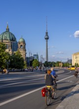 Road traffic and pedestrians on the carriageway in Berlin-Mitte, Unter den Linden, Berlin, Germany