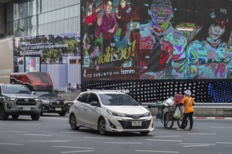Street crossing woman with cookshop, Bangkok, Thailand