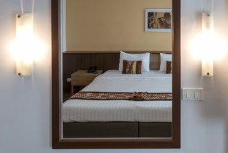 Symbol photo hotel room mirror bed