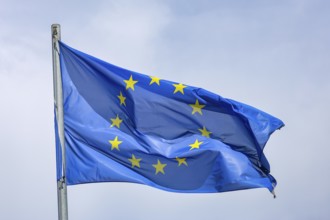 Düsseldorf, North Rhine-Westphalia, Germany - European flag fluttering in the wind on the flagpole,
