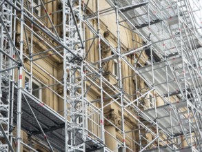 Scaffolded façade of the district court with metal platforms and stairs in Wuppertal, Germany