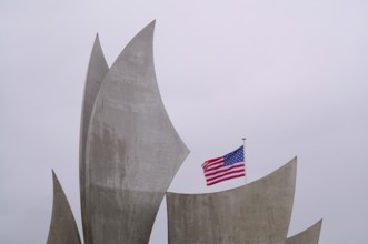 US flag, flag of the USA over Les Braves, memorial of Anilore Banon, polynational memorial to the