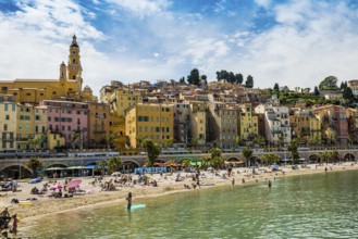 Town with colourful houses by the sea, Plage des Sablettes, Menton, Alpes Maritimes, Provence Alpes