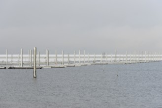 Winter day, onset of winter, snow on the jetties in the marina, North Sea, Norddeich, Lower Saxony,