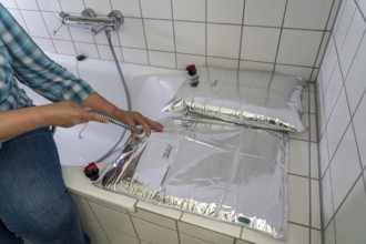 Filling a 10 litre water bag, for storing drinking water at home, as an emergency reserve in the