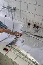 Filling a 10 litre water bag, for storing drinking water at home, as an emergency reserve in the