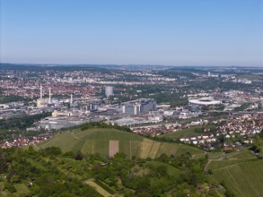 City panorama of Stuttgart with hills and vineyards, in the background the Mercedes-Benz plant in