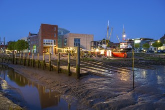 Town hall, harbour, low tide, illuminated, blue hour, Husum, North Sea, North Frisia,