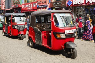 Motorized tuk tuk in a shopping street, Colombo, Sri Lanka