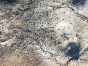 Broken, rocky ground with sparse vegetation. Aerial view. Drone shot. Southern Namibia