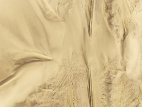 Rails covered with sand in the southern Namib Desert. Aerial view. Drone shot. Namibia