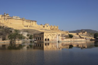 Amber Fort or fortress at Maota Lake on the Aravalli hill range, reflection in the water, Jaipur,