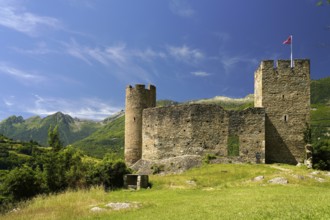 The ruins of the Château Sainte-Marie castle in Esterre and the mountain landscape near