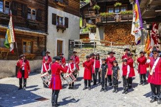Pipers and drummers play in the historic village centre, Grimentz, Val d'Anniviers, Valais Alps,