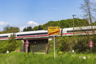 InterCityExpress ICE en route on the Swabian Alb near Lonsee. Landscape with railway bridge near