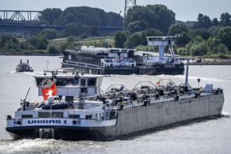 Cargo ships on the Rhine, in the background the Rhine bridge near Duisburg-Rheinhausen, Bridge of