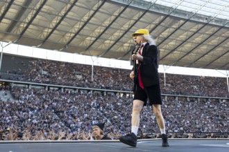 Angus Young, lead guitarist of AC/DC live on Power Up Tour 2025 at the Olympiastadion Berlin on 30