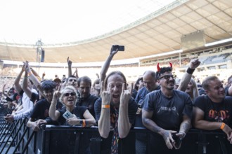 Fans in the front row in front of the concert of AC/DC live on Power Up Tour 2025 at the