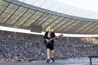 Angus Young, lead guitarist of AC/DC live on Power Up Tour 2025 at the Olympiastadion Berlin on 30