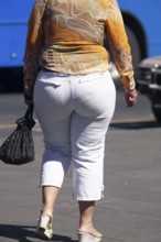 Woman walking in the street, From behind, Obesity, City of Quito. Pichincha province, Ecuador,