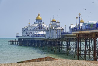 Beach and pier in Eastbourne, seaside resort on the English Channel, in the county of East Sussex,
