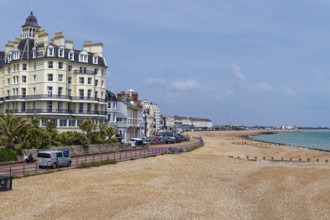 Beach and building on the seafront in Eastbourne, seaside resort on the English Channel, in the