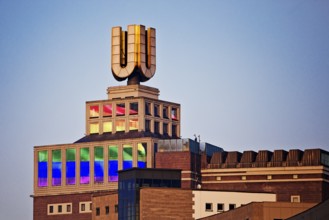 Dortmunder U, Flying pictures by Adolf Winkelmann at sunrise, Dortmund, Germany