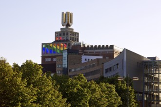 Dortmunder U, Flying pictures by Adolf Winkelmann with green trees, Dortmund, Germany