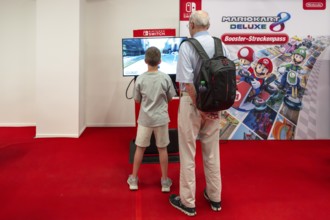 Symbol photo senior with boy playing games