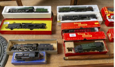 Model railway toy train set items on display for sale at auction room, UK