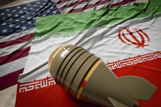 Nuclear bomb, american and Iranian flags resting on desert sand