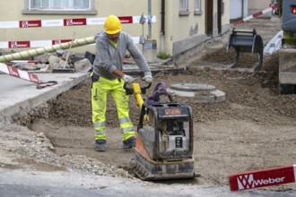 Construction site Road construction Construction worker Vibratory plate