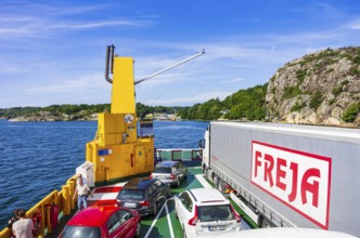 Cars and lorries on a car ferry operating as a floating road, near Lysekil, Bohuslän, Västra
