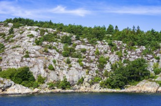 Wooded coastal landscape of granite rocks in the archipelago near Lysekil, Bohuslän, Västra
