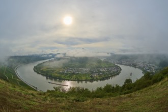 Picturesque river landscape with gentle hills and clouds in the haze of the sun, summer, Rhine bend
