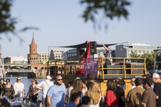 DJ on a houseboat on the Spree in front of the Oberbaum Bridge as part of the Fête de la Musique.