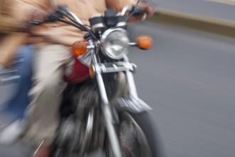 Man riding a motorcycle, Riding at high speed, Photo with motion blur, City of Quito, Pichincha