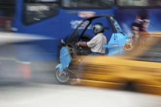 Man riding a motorcycle, Riding at high speed, Photo with motion blur, City of Quito, Pichincha